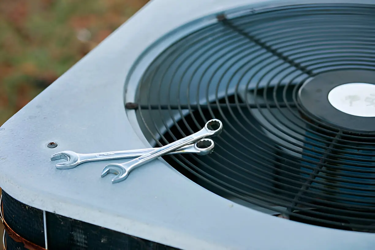 Home 13 Technician troubleshooting AC unit at a Tampa home.